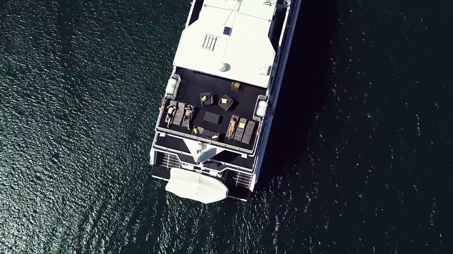 Aerial view of a Boattime superyacht cruising on deep blue water off the Gold Coast